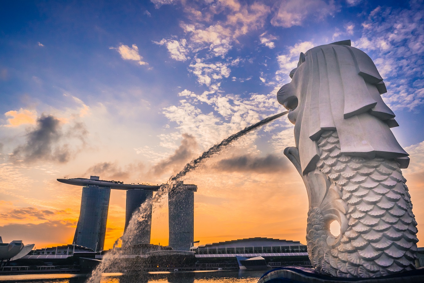The Merlion seen from its back with a view of Modern Stonehenge